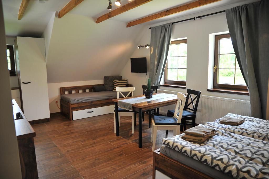 Postel nebo postele na pokoji v ubytování Apartmány U Fibichů