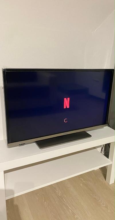 A television and/or entertainment centre at Florence Heart Uffizi - Renovated and central