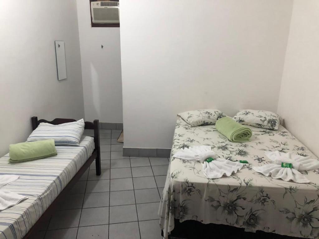 Postel nebo postele na pokoji v ubytování Pousada Caravelas - Centro de Paraty