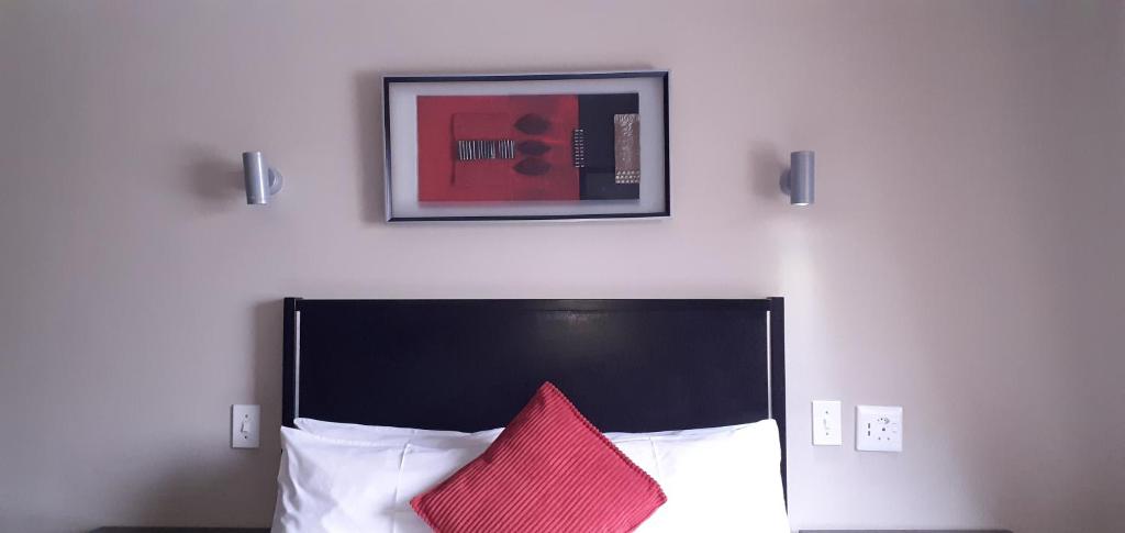 Ένα ή περισσότερα κρεβάτια σε δωμάτιο στο Comfy & Spacious Apartments