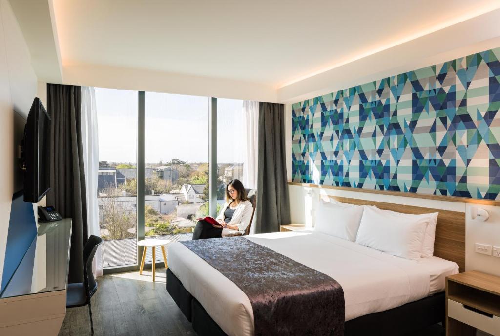Postel nebo postele na pokoji v ubytování Carnmore Hotel Christchurch