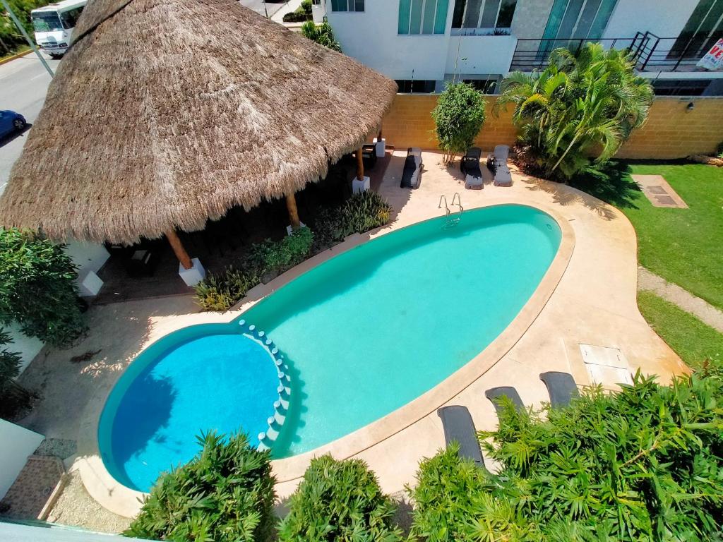 an overhead view of a swimming pool in a resort at Casa Punta Estrella in Playa del Carmen