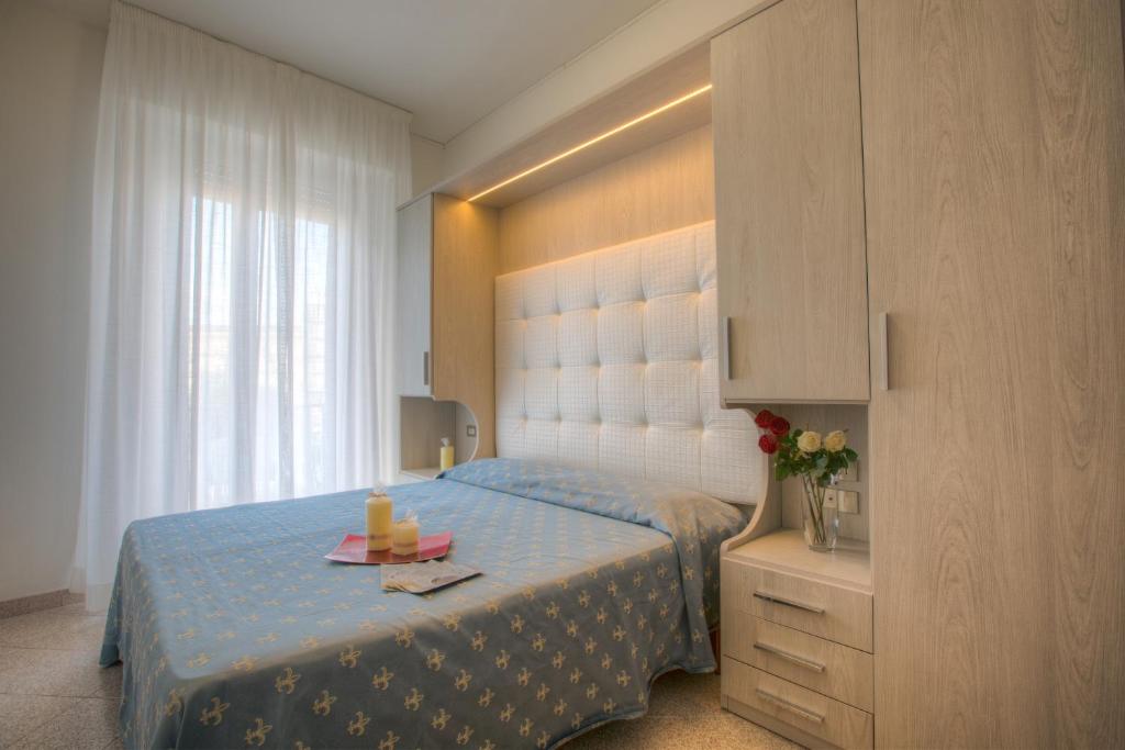 Postel nebo postele na pokoji v ubytování Hotel Olympia