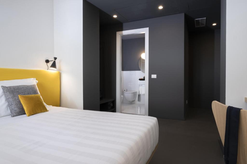 Postel nebo postele na pokoji v ubytování Camplus Hotel Roma Centro