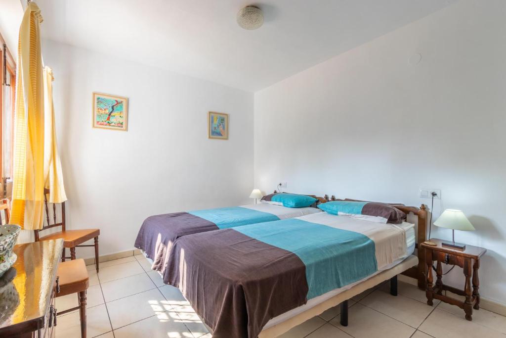 Postel nebo postele na pokoji v ubytování Villa Margarita