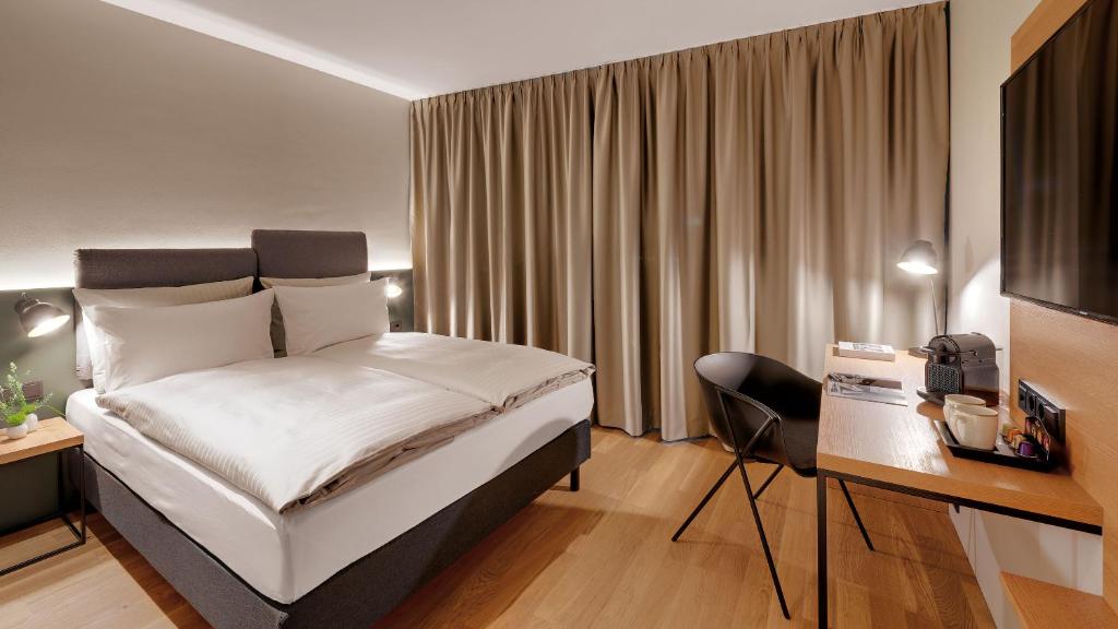 Postel nebo postele na pokoji v ubytování Hotel the YARD Berlin