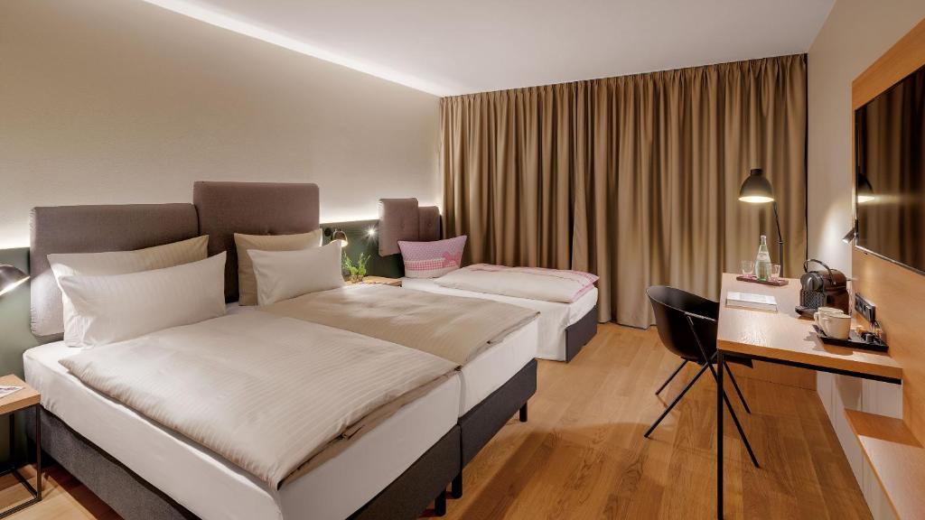 Postel nebo postele na pokoji v ubytování Hotel the YARD Berlin