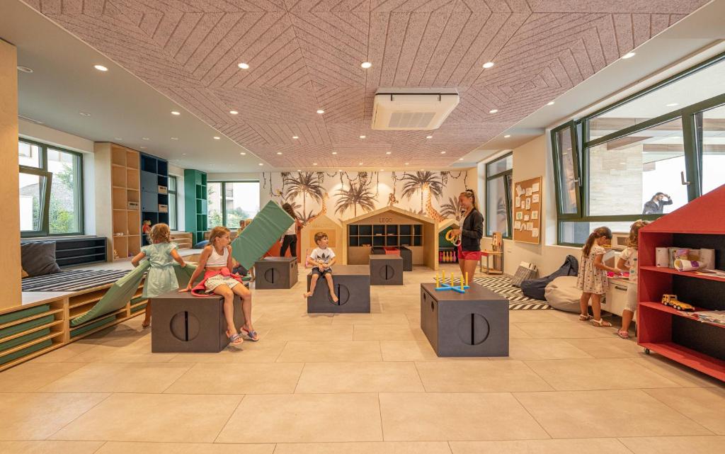 a store with dolls sitting on tables in a room at HVD Reina del Mar - Premium Spa Service & Free Parking in Obzor