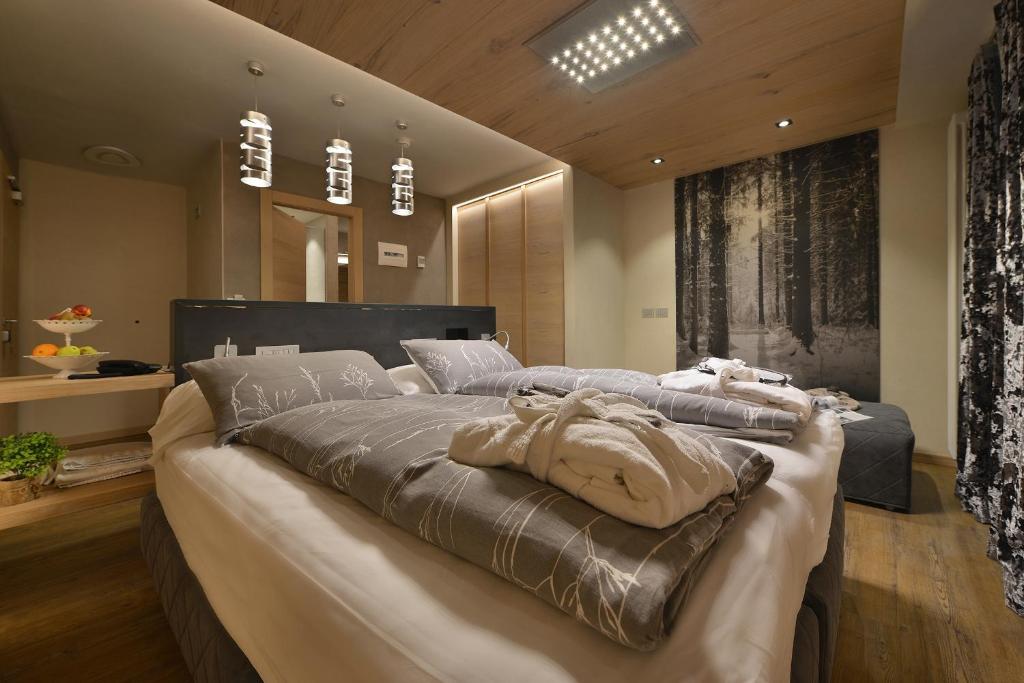 Postel nebo postele na pokoji v ubytování Hotel Compagnoni