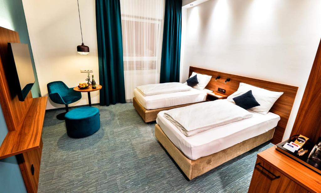 Voodi või voodid majutusasutuse Hotel Das Zeit toas