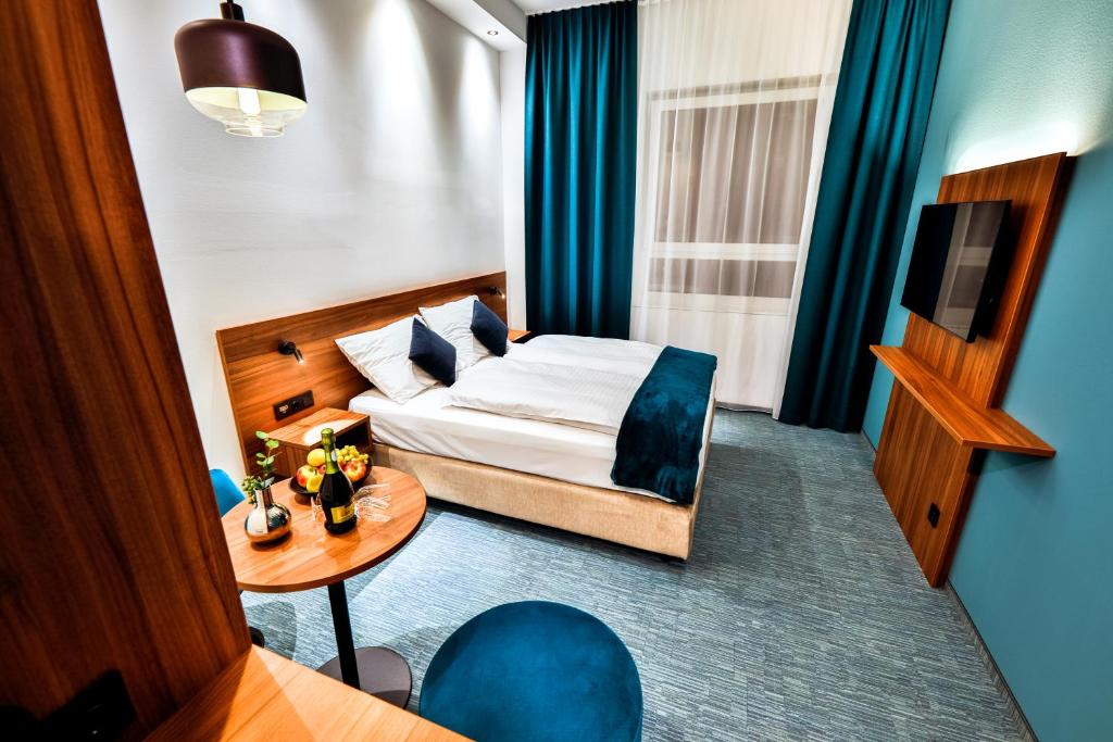 Voodi või voodid majutusasutuse Hotel Das Zeit toas
