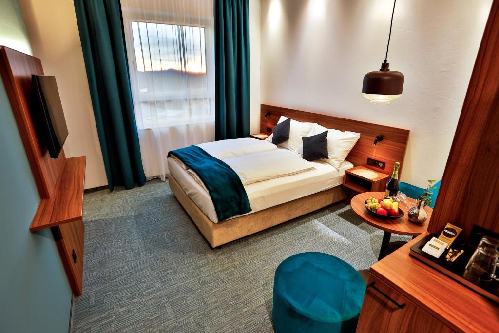 Voodi või voodid majutusasutuse Hotel Das Zeit toas