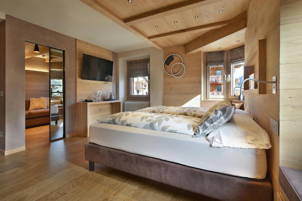 Postel nebo postele na pokoji v ubytování Hotel Compagnoni