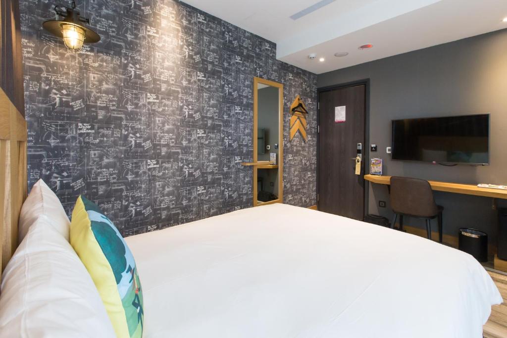 Postel nebo postele na pokoji v ubytování Norway Forest Travel hotel 3 Taichung