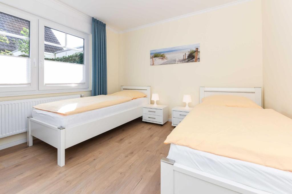 Postel nebo postele na pokoji v ubytování Haus Meerzeit