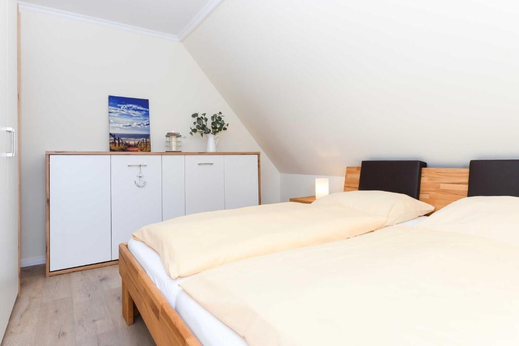 Postel nebo postele na pokoji v ubytování Haus Meerzeit
