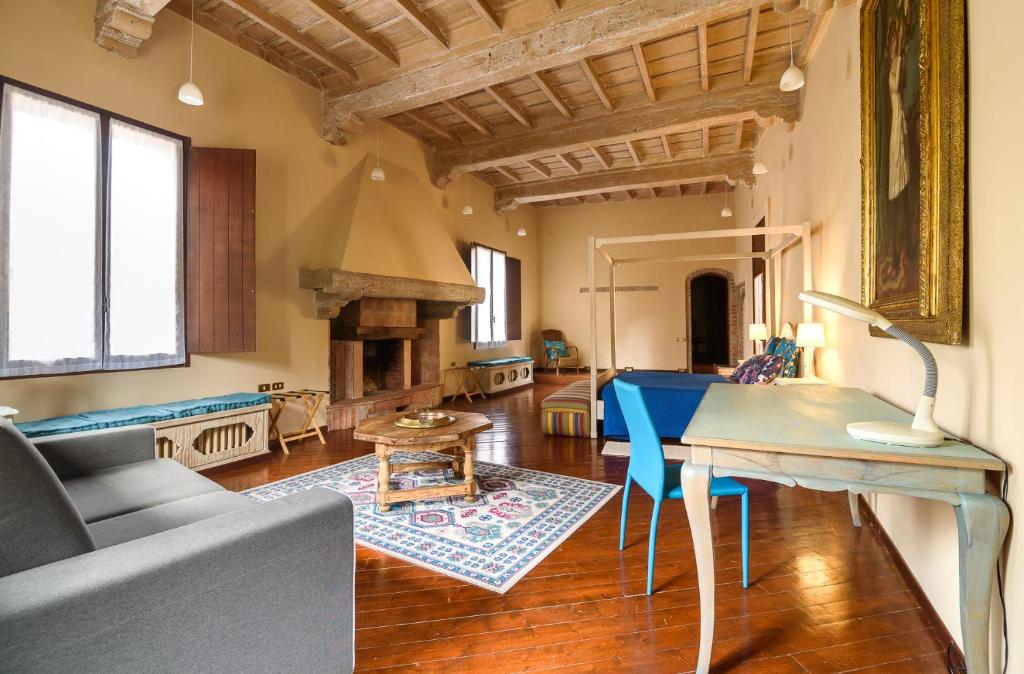 a living room with a couch and a table at Castello di Montonate in Mornago