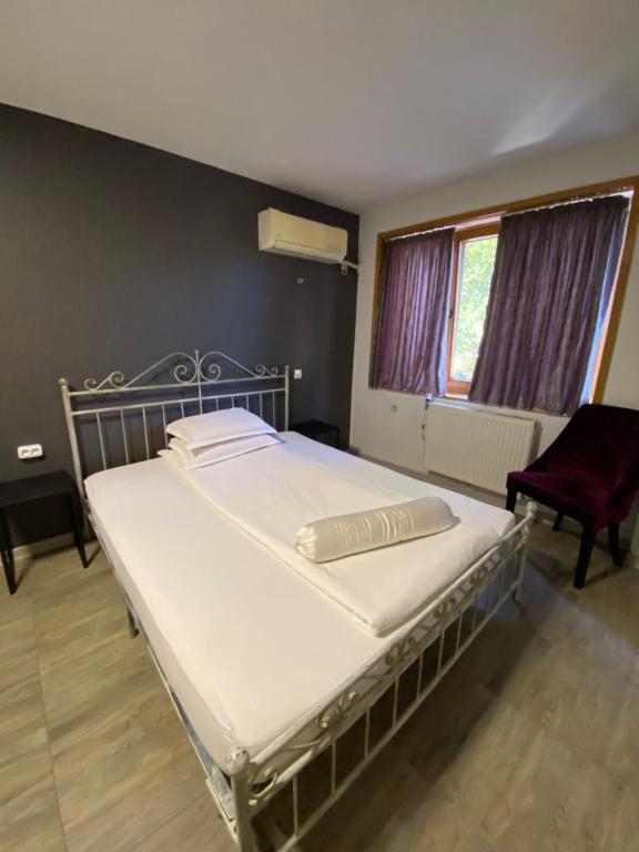 Postel nebo postele na pokoji v ubytování Family Hotel Amor