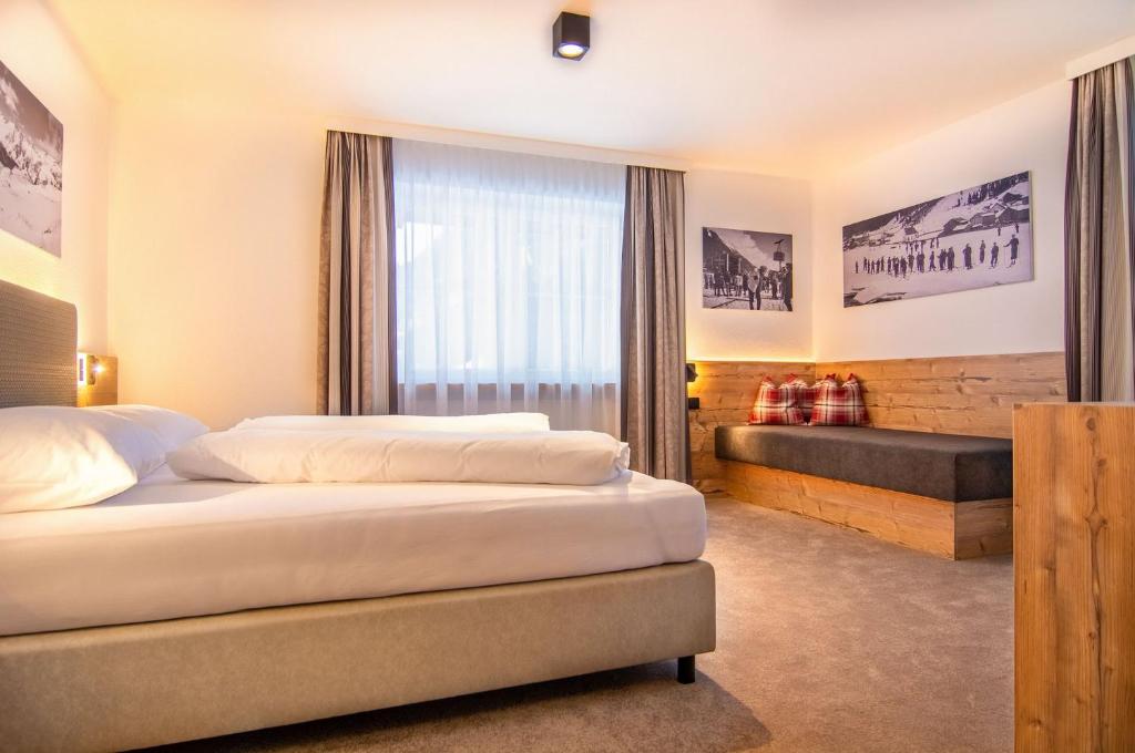 Postel nebo postele na pokoji v ubytování Hotel Garni Waldschlössl