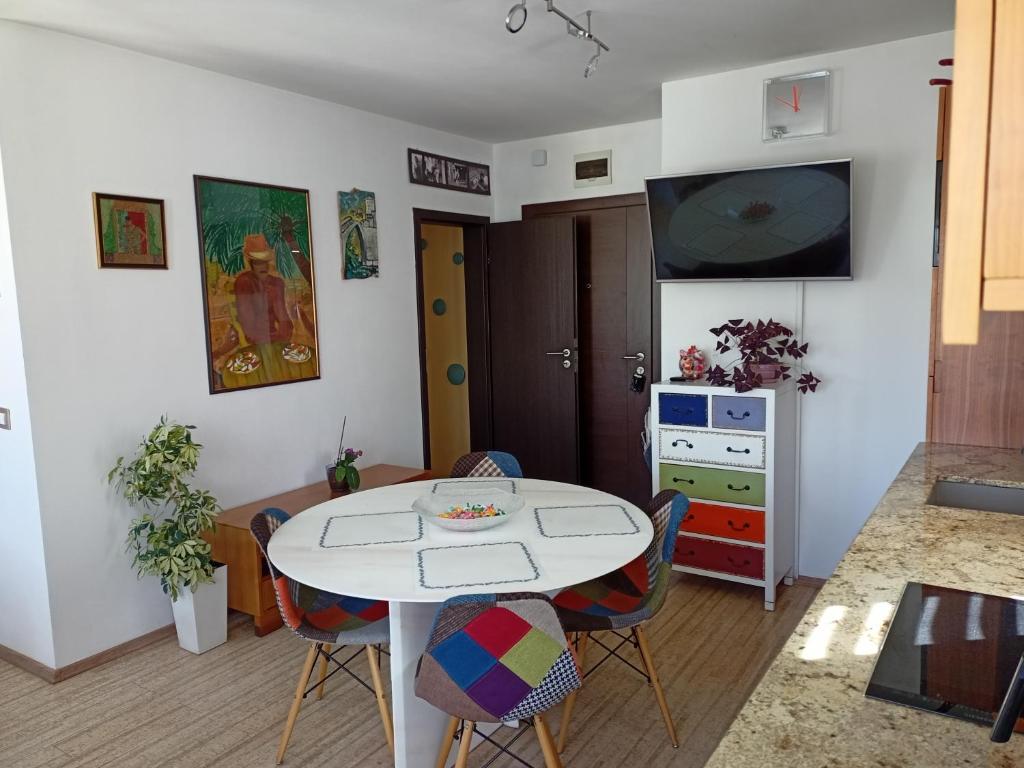 a living room with a white table and chairs at Bright apartment at a great location in Sofia