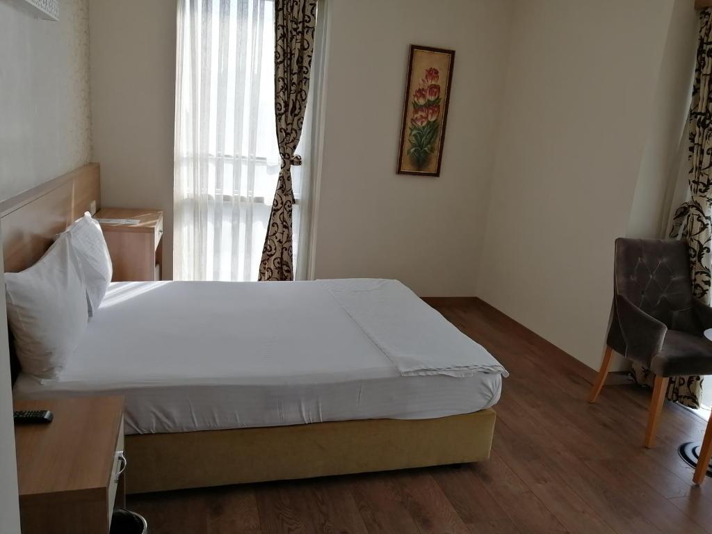 Postel nebo postele na pokoji v ubytování Nice Royal