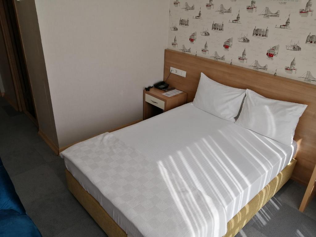Postel nebo postele na pokoji v ubytování Nice Royal