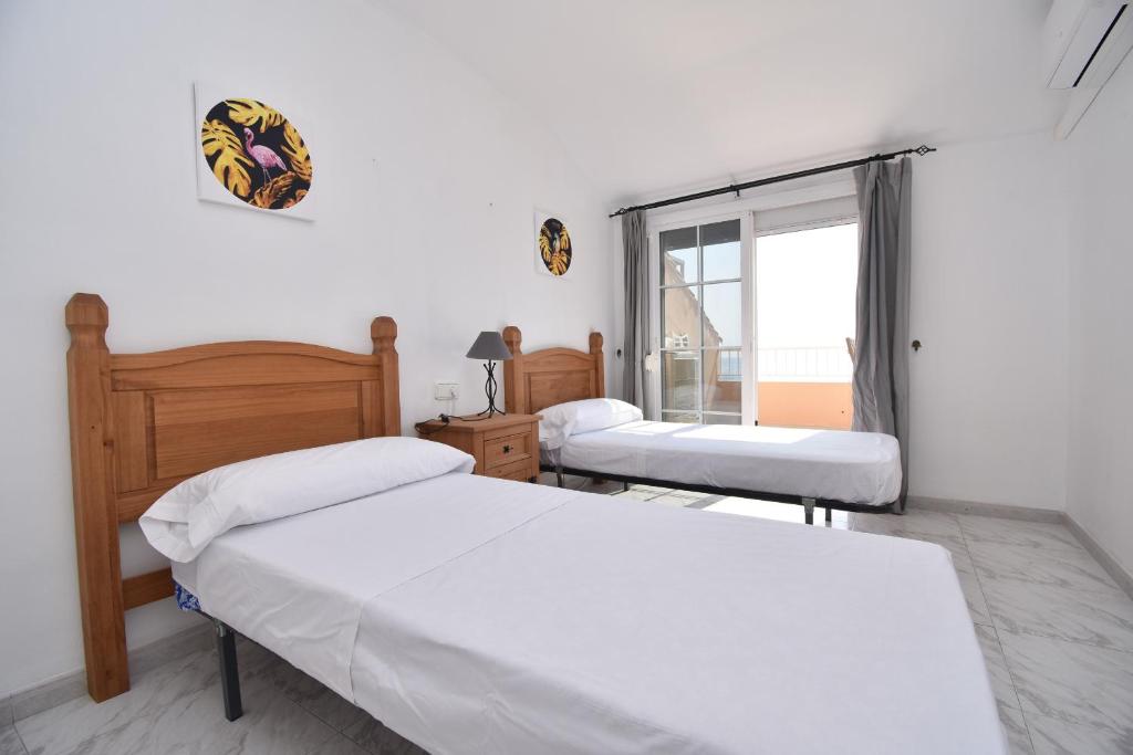 Postel nebo postele na pokoji v ubytování Apartamento Familiar Caracola Playa