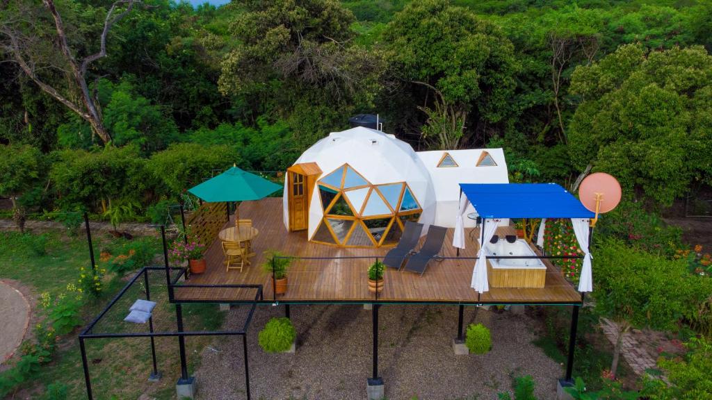 an aerial view of a yurt with a tent at Glamping Girardot & Hotel Puerta Del Sol Girardot in La Virginia
