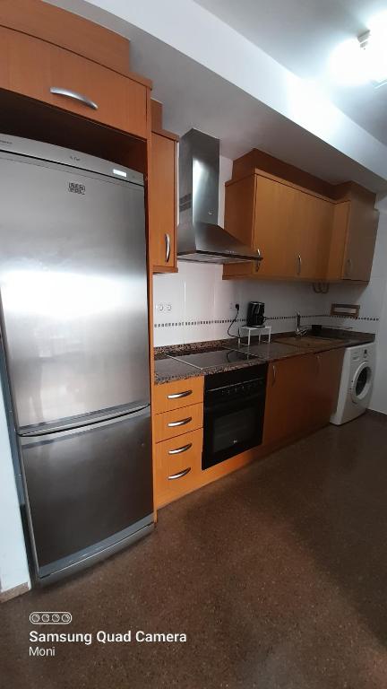 Kuchyň nebo kuchyňský kout v ubytování Piso Casa Reina Un lugar cerca del mar y el puerto