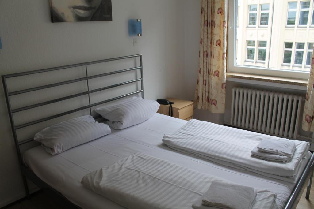 Postel nebo postele na pokoji v ubytování Hotel Lilienhof