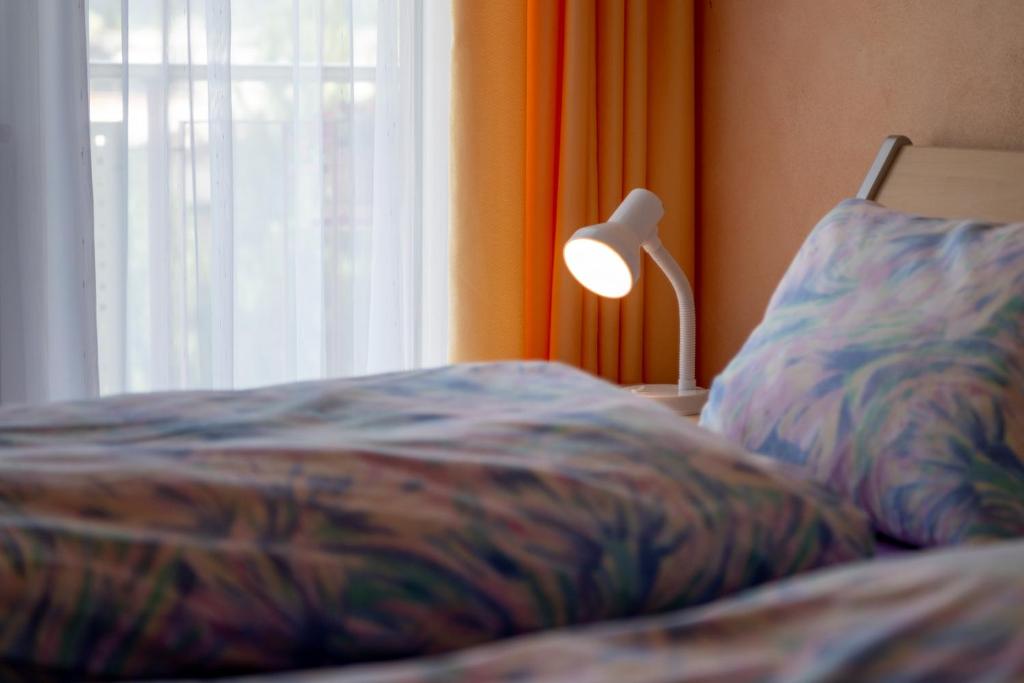 Postel nebo postele na pokoji v ubytování Haus Aurora