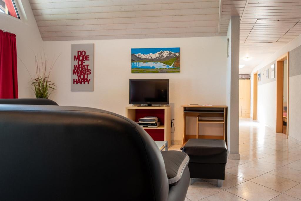 TV a/nebo společenská místnost v ubytování Haus Aurora