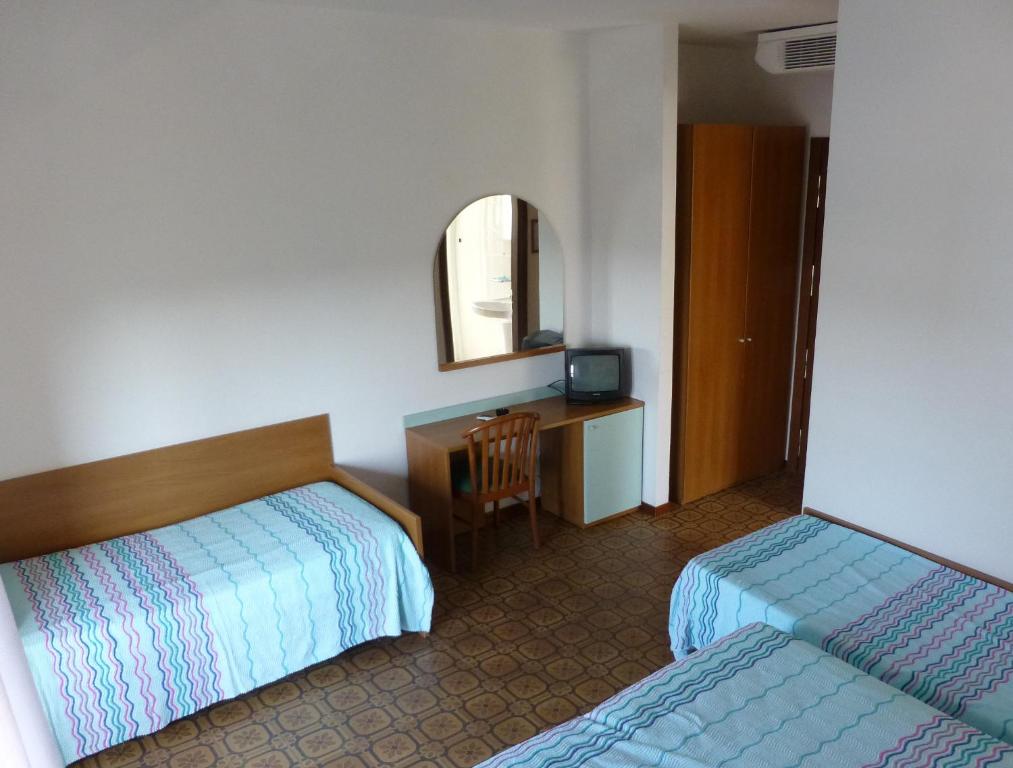 Postel nebo postele na pokoji v ubytování Hotel Sole