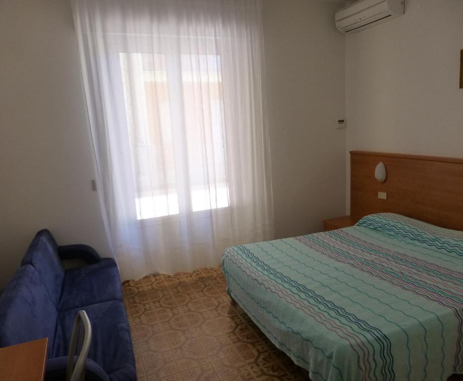 Postel nebo postele na pokoji v ubytování Hotel Sole