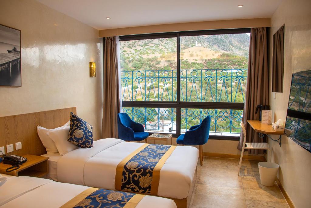 Postel nebo postele na pokoji v ubytování VANCII Hotel