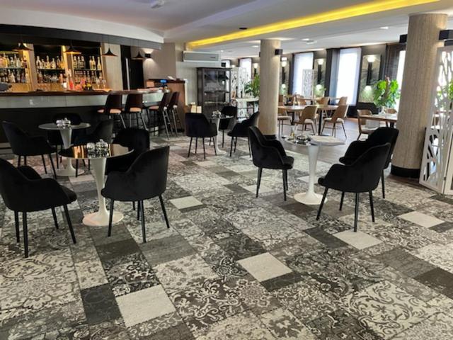 Reštaurácia alebo iné gastronomické zariadenie v ubytovaní Arena Hotel Spa & Wellness