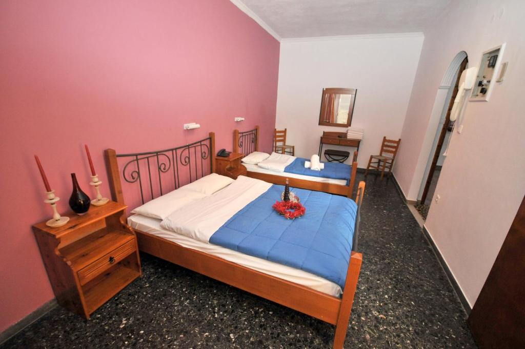 Postel nebo postele na pokoji v ubytování Hotel Galaxy