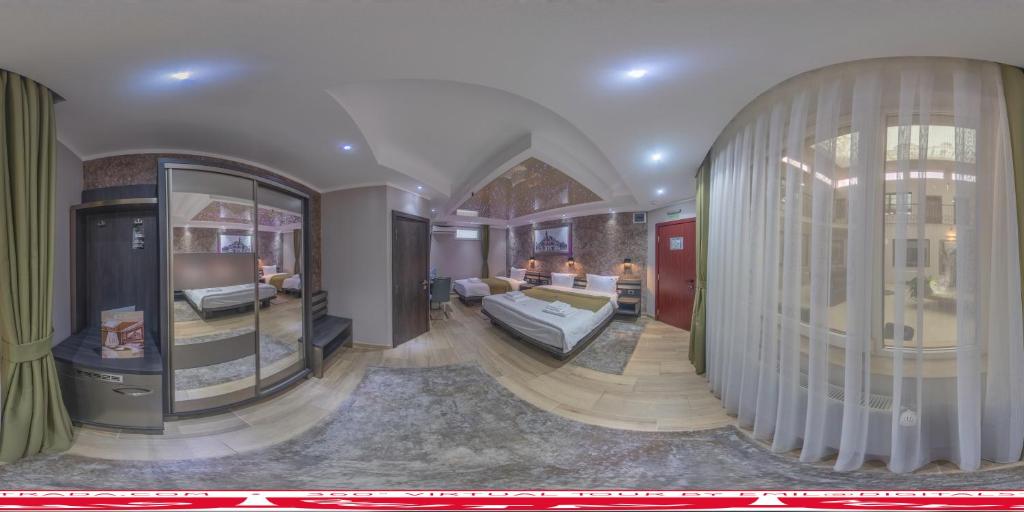 Postel nebo postele na pokoji v ubytování Hotel Novotheos
