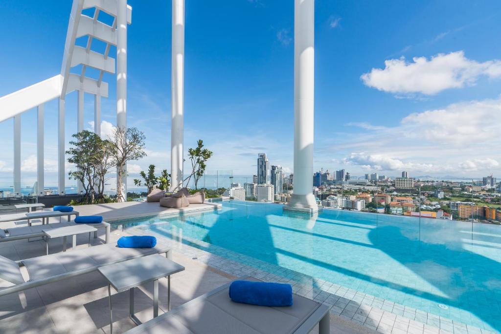 a swimming pool on the roof of a building at Arbour Hotel and Residence in Pattaya