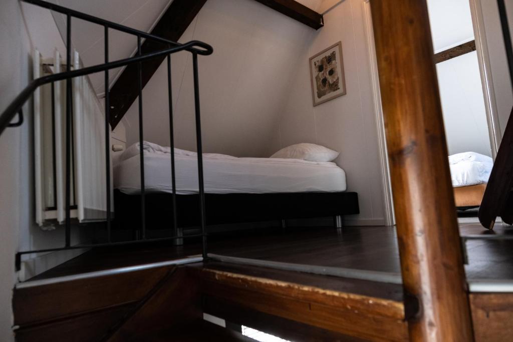 Een bed of bedden in een kamer bij De Soeten Inval