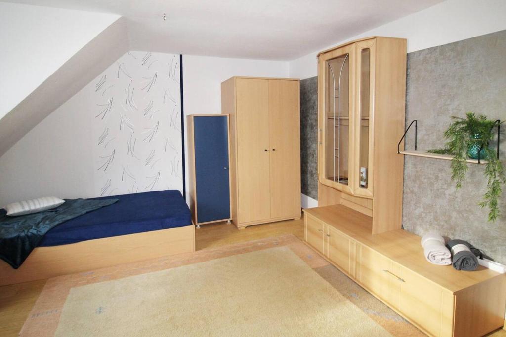 Postel nebo postele na pokoji v ubytování Work & Stay Apartment