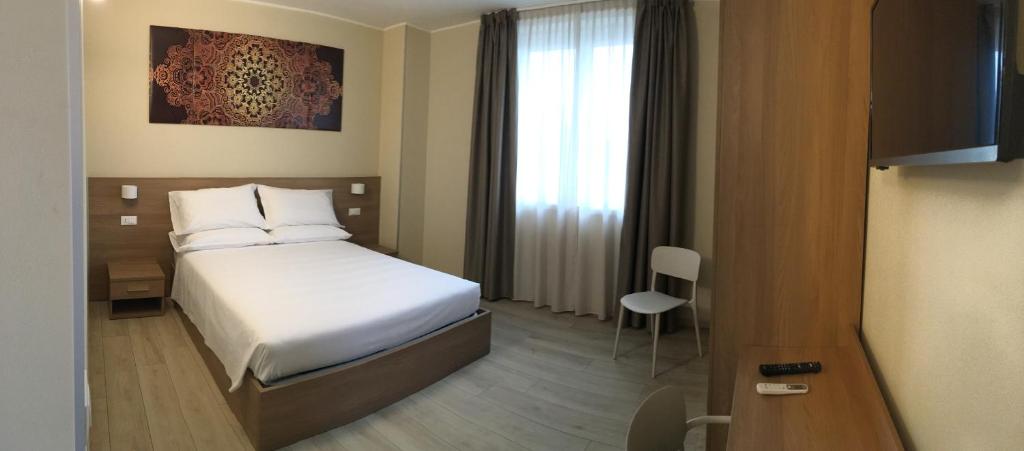Postel nebo postele na pokoji v ubytování TERRAZZA Rooms