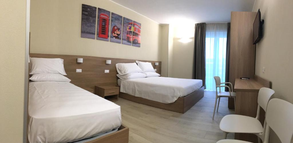 Postel nebo postele na pokoji v ubytování TERRAZZA Rooms