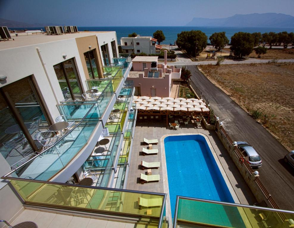 an aerial view of a building with a swimming pool at Crystal Bay Hotel in Kissamos