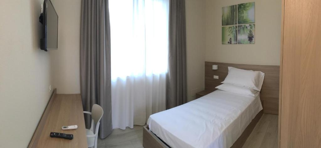 Postel nebo postele na pokoji v ubytování TERRAZZA Rooms