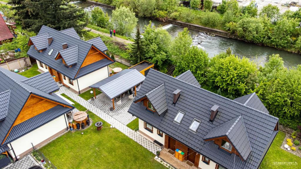 an overhead view of a house with roofs at Domki Lubiane in Brenna