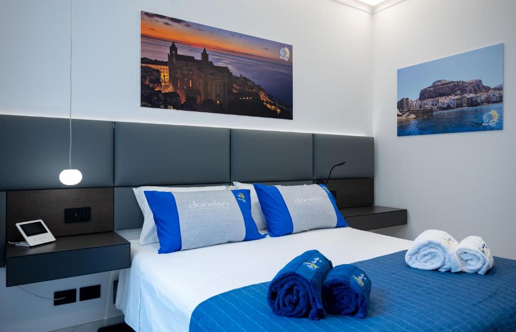 Postel nebo postele na pokoji v ubytování BM SUITES CEFALU