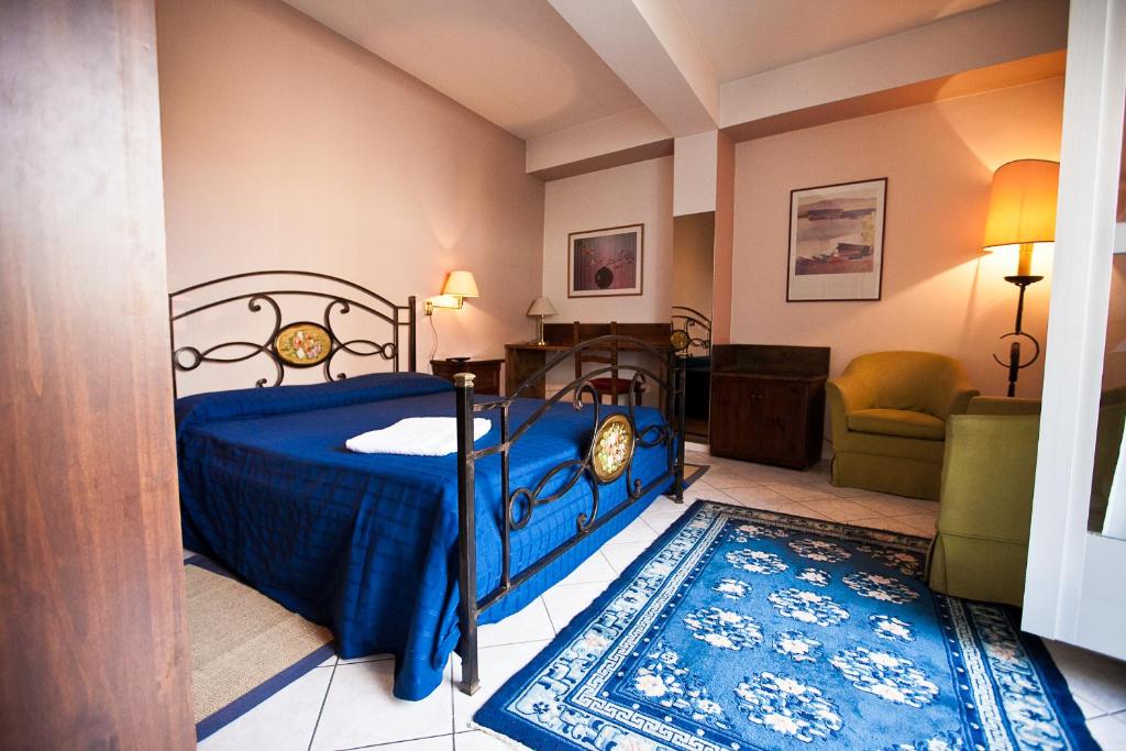 Postel nebo postele na pokoji v ubytování Hotel Rainero