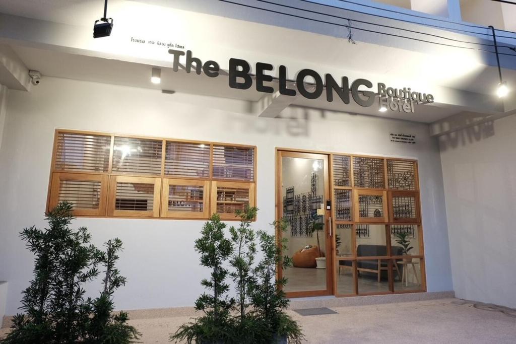 a store with a sign that reads the before hurting at THE BELONG BOUTIQUE HOTEL in Phuket