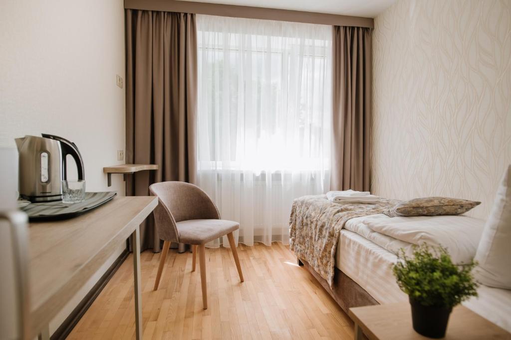 Postel nebo postele na pokoji v ubytování ОРАНТА